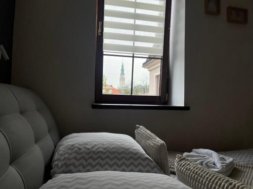Ένα ή περισσότερα κρεβάτια σε δωμάτιο στο Apartamenty AP 13