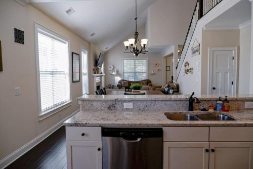 a kitchen with a sink and a counter top at The Garnet Door Bungalow in Columbia