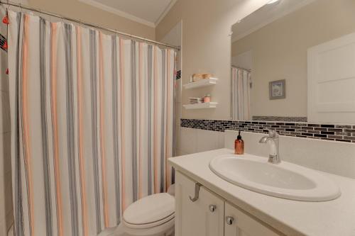 a bathroom with a sink and a shower curtain at Walk Cottontown Cozy Casa in Columbia