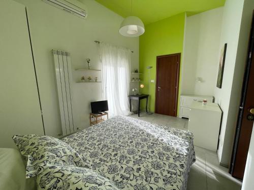 a bedroom with a bed and a window at San Lollo Room in Rome