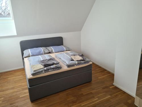 a bed in the corner of a room at GardenLoft no4 - enjoy in Vienna