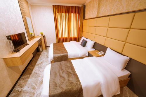 Sarok Hotelにあるベッド