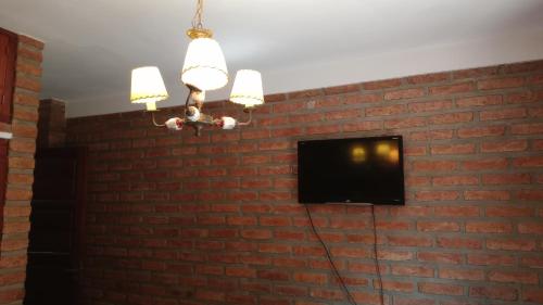 TV a/nebo společenská místnost v ubytování Alojamiento Los Amigos