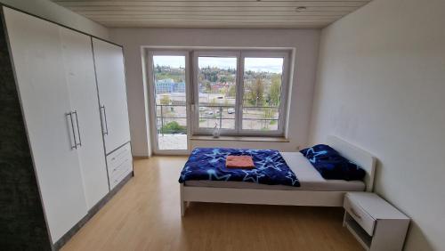 Postel nebo postele na pokoji v ubytování Rooms & Apartments Schwäbisch Gmünd