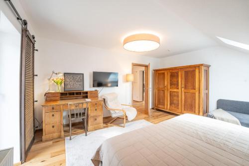 Una televisión o centro de entretenimiento en Appartements Kraischaberg
