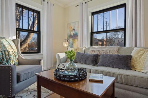 a living room with a couch and a coffee table at Newly Renovated in the Heart of Historic Loveland in Loveland
