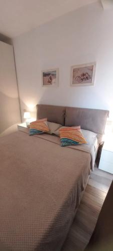 a bedroom with a bed with two pillows on it at Sal Rei apartaments, Boa Vista, free WI-FI in Sal Rei