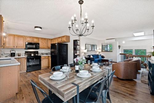 a kitchen and dining room with a table and chairs at The Horsetooth Stoop - Biking, Boating & Sunsets in Fort Collins