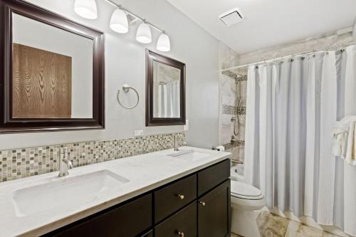 a bathroom with a sink and a toilet at The Horsetooth Stoop - Biking, Boating & Sunsets in Fort Collins
