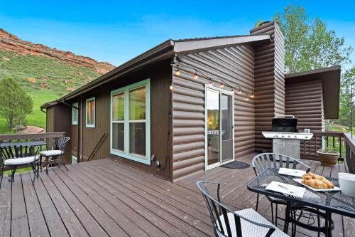 a house with a deck with a grill at The Horsetooth Stoop - Biking, Boating & Sunsets in Fort Collins