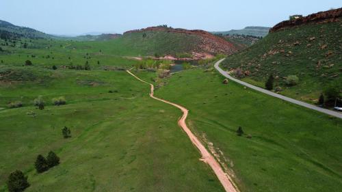 an aerial view of a field with a road at The Horsetooth Stoop - Biking, Boating & Sunsets in Fort Collins