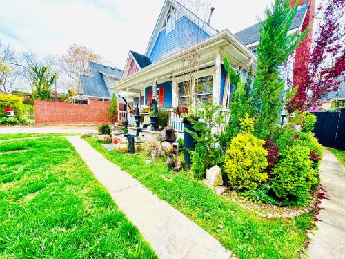 a house with a dog standing in front of it at Zen Life Oasis in Atlanta