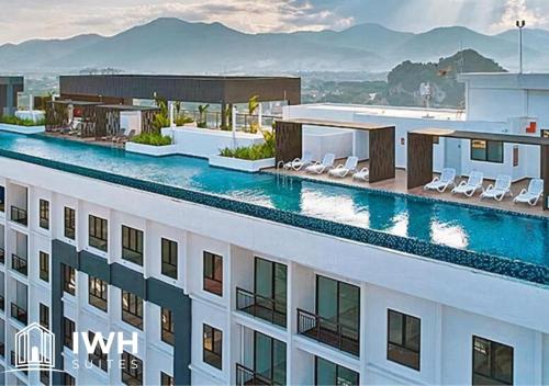 a view of a building with a swimming pool at Ipoh Horizon Skypool Town Suites 4-11pax by IWH Suites in Ipoh