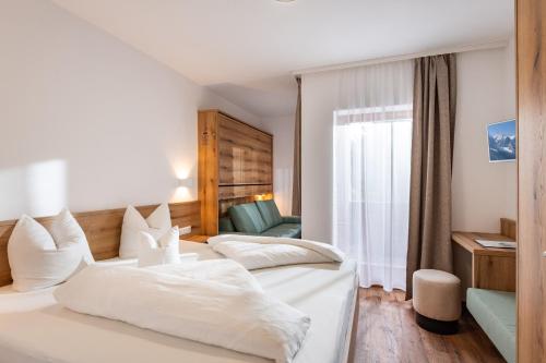 Cama ou camas em um quarto em Pension Gieringer