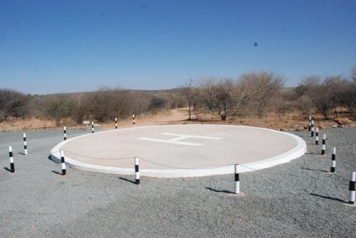 a large circle in the middle of a parking lot at Oppi-Koppi Rest Camp in Kamanjab