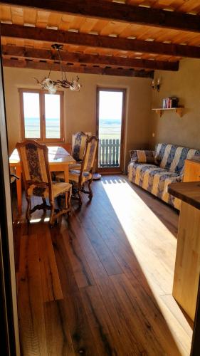 a living room with a table and a couch at Holiday House Clavis in Dobrovnik