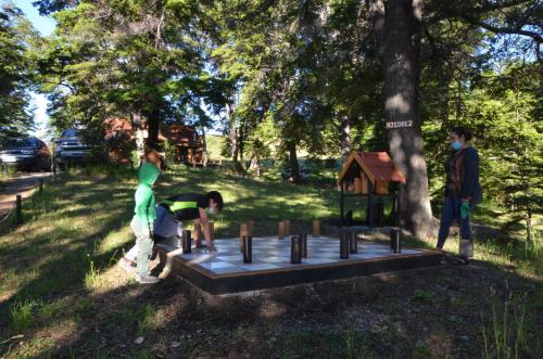 a group of people playing in a park at Terra Luna Lodge in Puerto Guadal