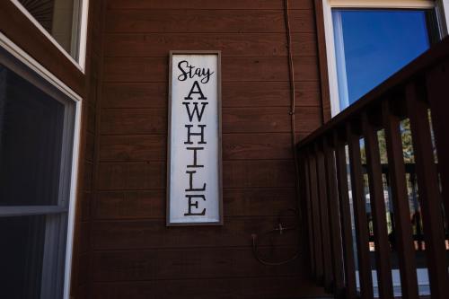 a sign on the side of a wooden house at ULTIMATE Mountain Escape with Pool & Hot Tub & Firepit in Sedona