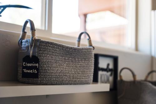 a basket sitting on a shelf next to a window at ULTIMATE Mountain Escape with Pool & Hot Tub & Firepit in Sedona