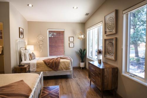 a bedroom with two beds and a window at ULTIMATE Mountain Escape with Pool & Hot Tub & Firepit in Sedona