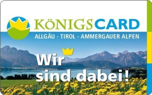 a sign that reads wir and dalldadi with a field of flowers at Gästehaus Kerpf incl KönigsCard in Nesselwang