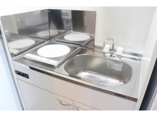 a bathroom with a sink and four toilets at Sakuraya - Vacation STAY 14453v in Takahara