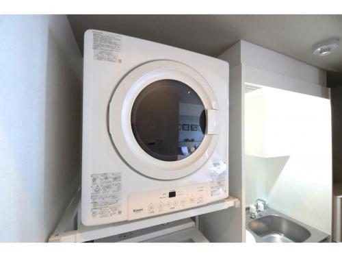 a washing machine in a kitchen with a sink at Sakuraya - Vacation STAY 14453v in Takahara