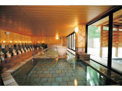 a large room with a large bowl in the middle of it at Senshunraku - Vacation STAY 18450v in Hagi
