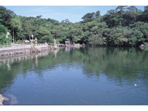 a body of water with trees in the background at Senshunraku - Vacation STAY 18475v in Hagi