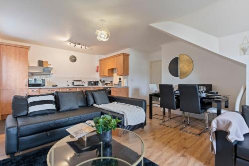 a living room with a couch and a table at City Gate in Birmingham