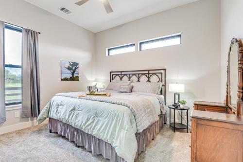 a bedroom with a large bed and a dresser at Northlake Vacation Rental with Pool and Hot Tub Access in Northlake