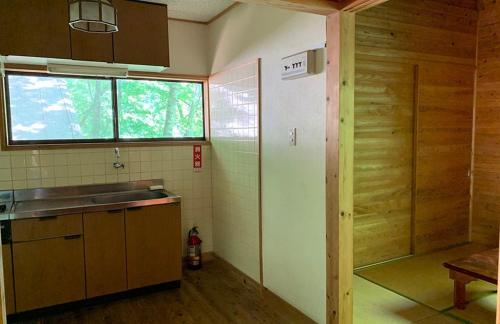 a small kitchen with a sink and a window at Yato Furusato Forest - Vacation STAY 21069v 