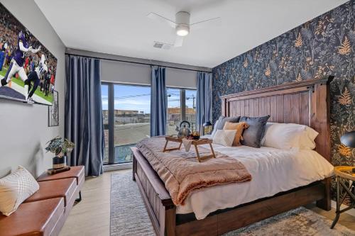 a bedroom with a large bed and a large window at Hyve - Whiskey Trails - Walk to Broadway in Nashville