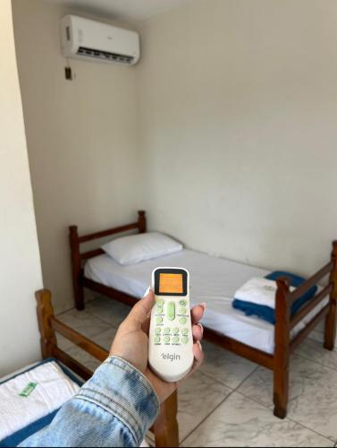 Ένα ή περισσότερα κρεβάτια σε δωμάτιο στο Pousada Quartos vcp