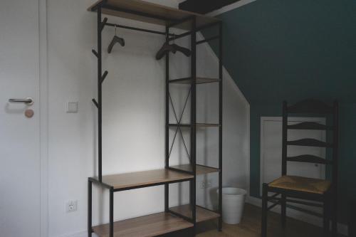 a book shelf in a room next to a door at Altstadt Quartier in Schotten