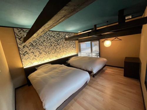 Ένα ή περισσότερα κρεβάτια σε δωμάτιο στο Tonegun - House - Vacation STAY 16434