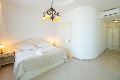 Postel nebo postele na pokoji v ubytování COLUMBUS Apartamenty Ustka - Marynarki Polskiej 2