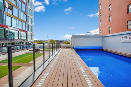 a swimming pool on the side of a building at Hobson Apartment with Pool and View in Auckland