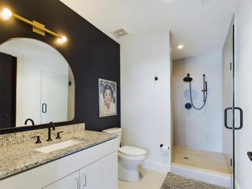 a bathroom with a sink and a toilet and a shower at Foxtrot Tango - 2 New Homes - 12 South in Nashville