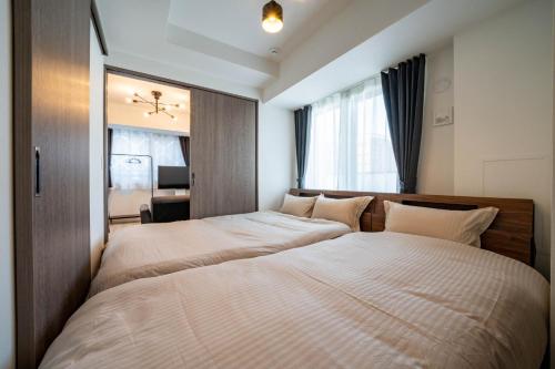 Cama ou camas em um quarto em Mondomio Sapporo Minami 3-jo Dori 603 - Vacation STAY 16446