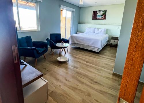 Ένα ή περισσότερα κρεβάτια σε δωμάτιο στο Casa Beira Mar