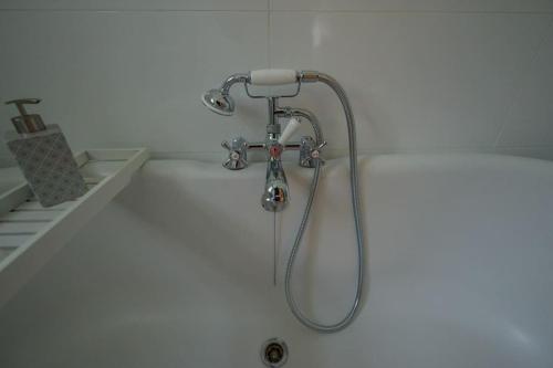 a shower in a bathroom with a shower head at Number 2 in Mountain Ash
