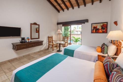 Una cama o camas en una habitación de Hacienda Buenaventura Hotel & Mexican Charm - All Inclusive