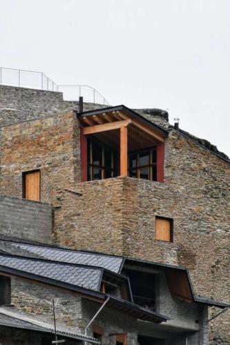 a brick building with a window on top of it at Cal cavalé in Vall de Castellbò