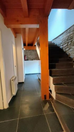 a hallway with a staircase in a house at Cal cavalé in Vall de Castellbò
