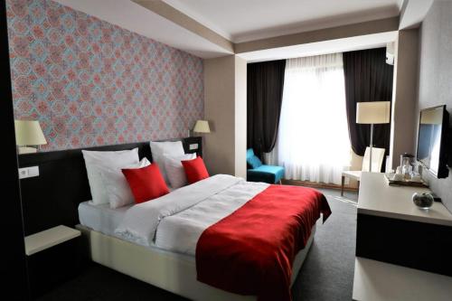 East Gate Boutique Hotelにあるベッド
