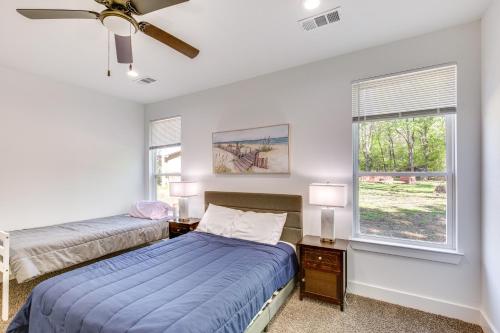 a bedroom with two beds and a window at Fire Pit and Grill Lakeside Gun Barrel City Home! in Gun Barrel City