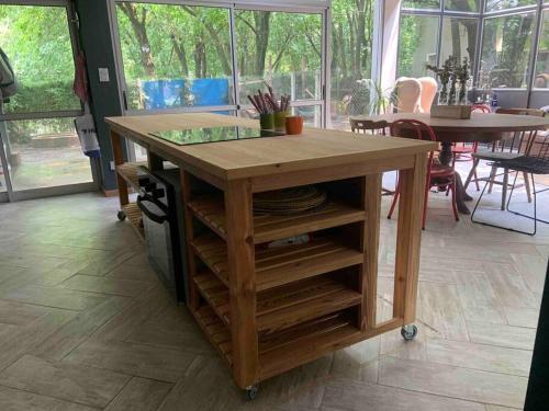 a wooden table with a glass top on a table at Loft moderno en medio del bosque in Arturo SeguÃ­