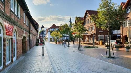 a cobblestone street in a town with buildings at Ferienwohnung Auenglück "Innenhof" inkl THERMEplus in Bad Bevensen