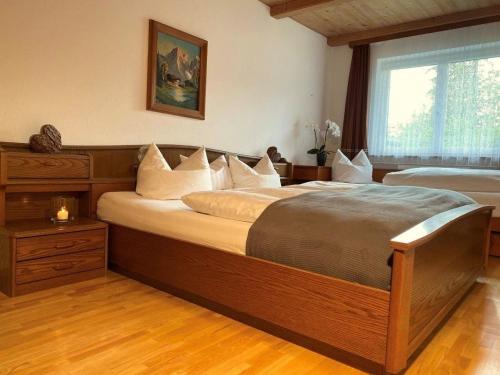 מיטה או מיטות בחדר ב-Tolle Ferienwohnung in Vorderthiersee mit Grill, Garten und Terrasse